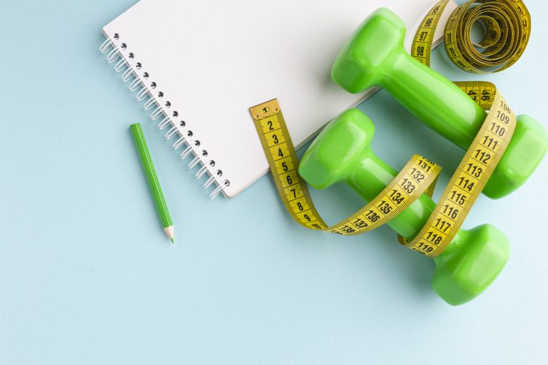 green weights, meter, notebook