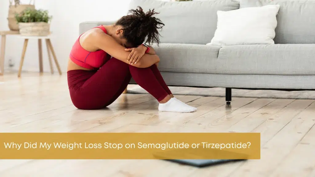 Woman sitting on the floor after hitting a weight loss plateau while taking semaglutide or tirzepatide.